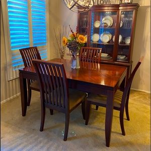 Dining room table with four matching chairs